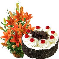 Send 12 Orange Lily Arrangement 1 Kg Black Forest Cake Bhai Dooj gift hamper