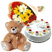 1 Kg Pineapple Cake, 12 Gerbera Bouquet, 1 Valentine's Day Teddy Bear