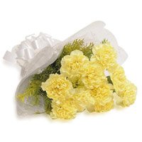 Send Online Rakhi and Yellow Carnation Bouquet to India