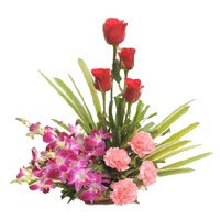 Send rchids, Roses, Carnation Basket 12 Flowers with Rakhi in India