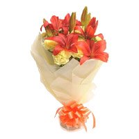Buy Rakhi and Orange Lily 12 Yellow Carnation Flowers in India