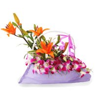 Send Rakhi with 9 Orchids 3 Lily Flower Arrangement to India