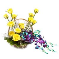 Send 6 Orchids 12 Roses Flower Arrangement with Rakhi in India
