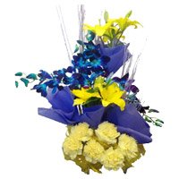 Send 4 Yellow Lily 4 Blue Orchids 6 Yellow Carnation Basket with Rakhi to India