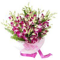 Order Rakhi and Online Purple Orchid Bunch 6 Flowers to India with Rakhi